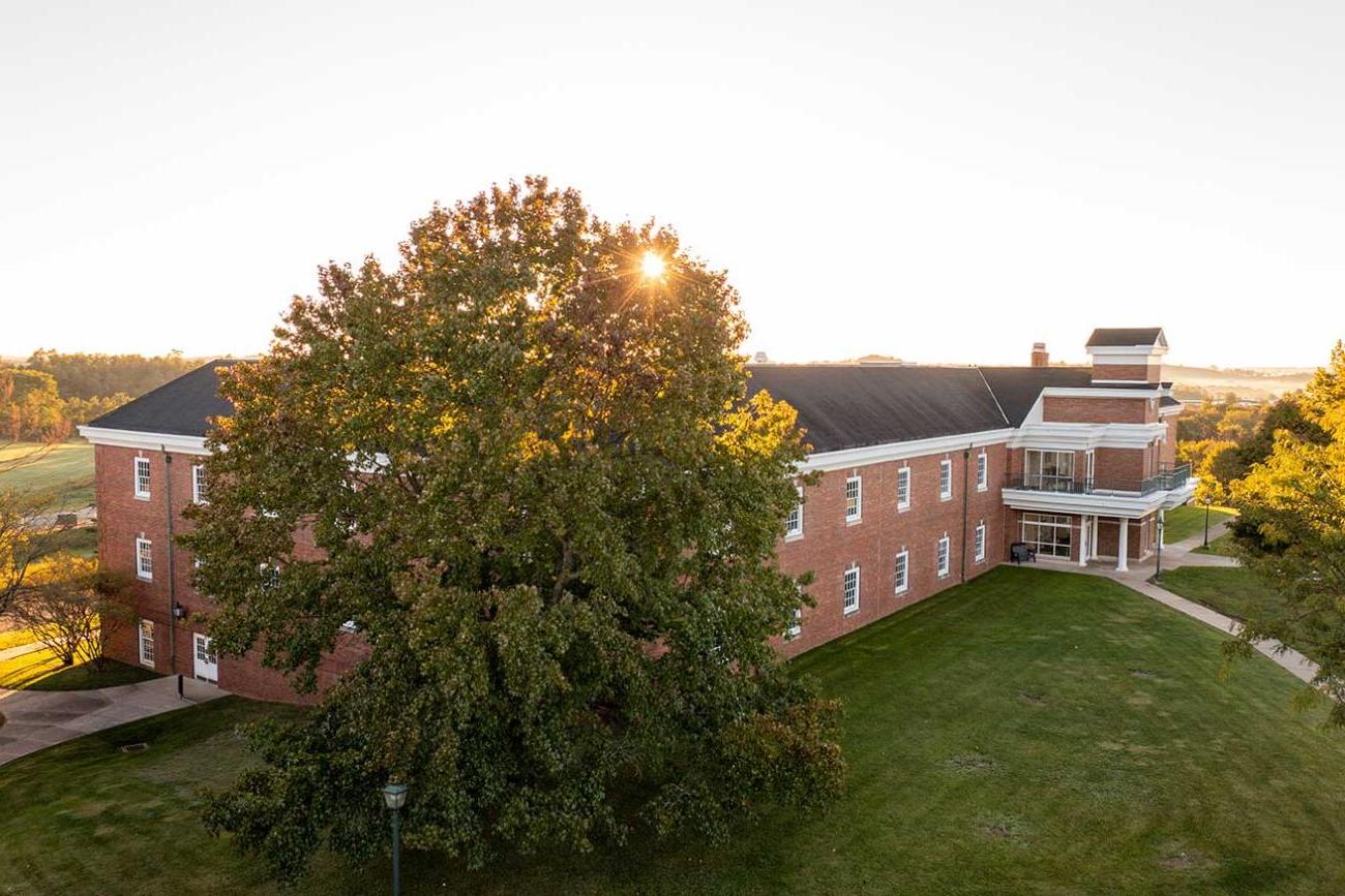 Photo of a building and tree on the Eastern campus